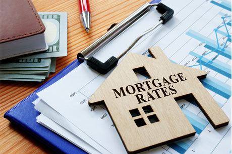 Mortgage rates sign on the home and charts